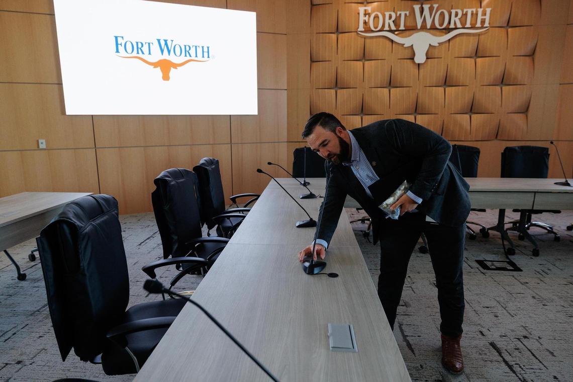 Tanyan Farley, project manager for Athenian Group, demonstrates the audio capabilities in the new Fort Worth City Council work room on Monday, March 24, 2025. The city will welcome the public into the chambers for the first time on Tuesday.