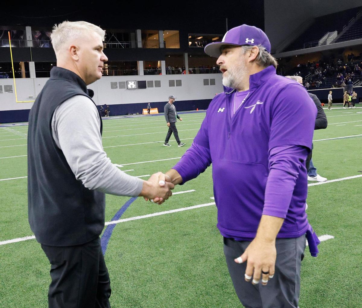 Panther Creek head coach Clint Surratt and Alvarado head coach Casey Walraven exchange pleasantries after their UIL 4A D1 Area round football playoff game at The Ford Center in Frisco Texas, Thursday, Nov. 21, 2024.