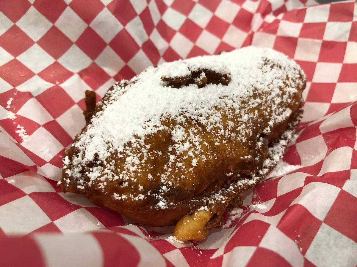 The Sweet Bakin’ Bacon takes a Twinkie-esque icing-filled sponge cake and wraps it in bacon, then dips it in funnel-cake batter and fries it.