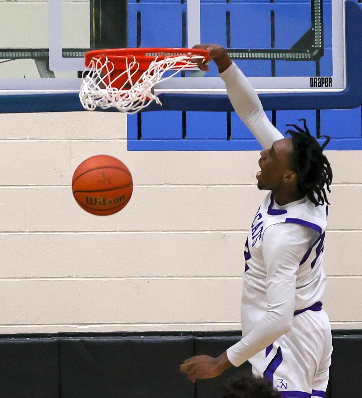 Byron Nelson forward Jesse Iweze slams home two points against Eaton during the second half of a High School Basketball game played at Byron Nelson High School on January 19, 2021. (Steve Nurenberg Special to the Star-Telegram)