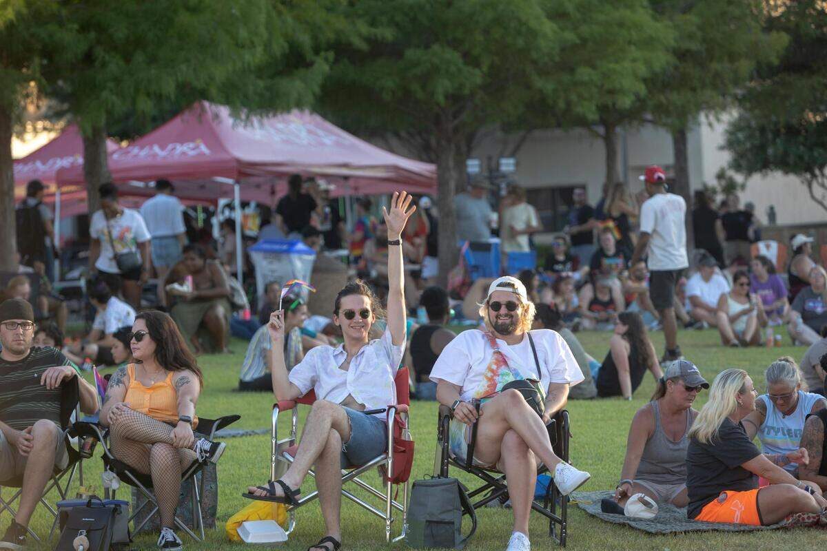 Chance Bowman and William Mankin on the lawn at Magnolia Green Park during Trinity Pride on Saturday, June 25, 2022.