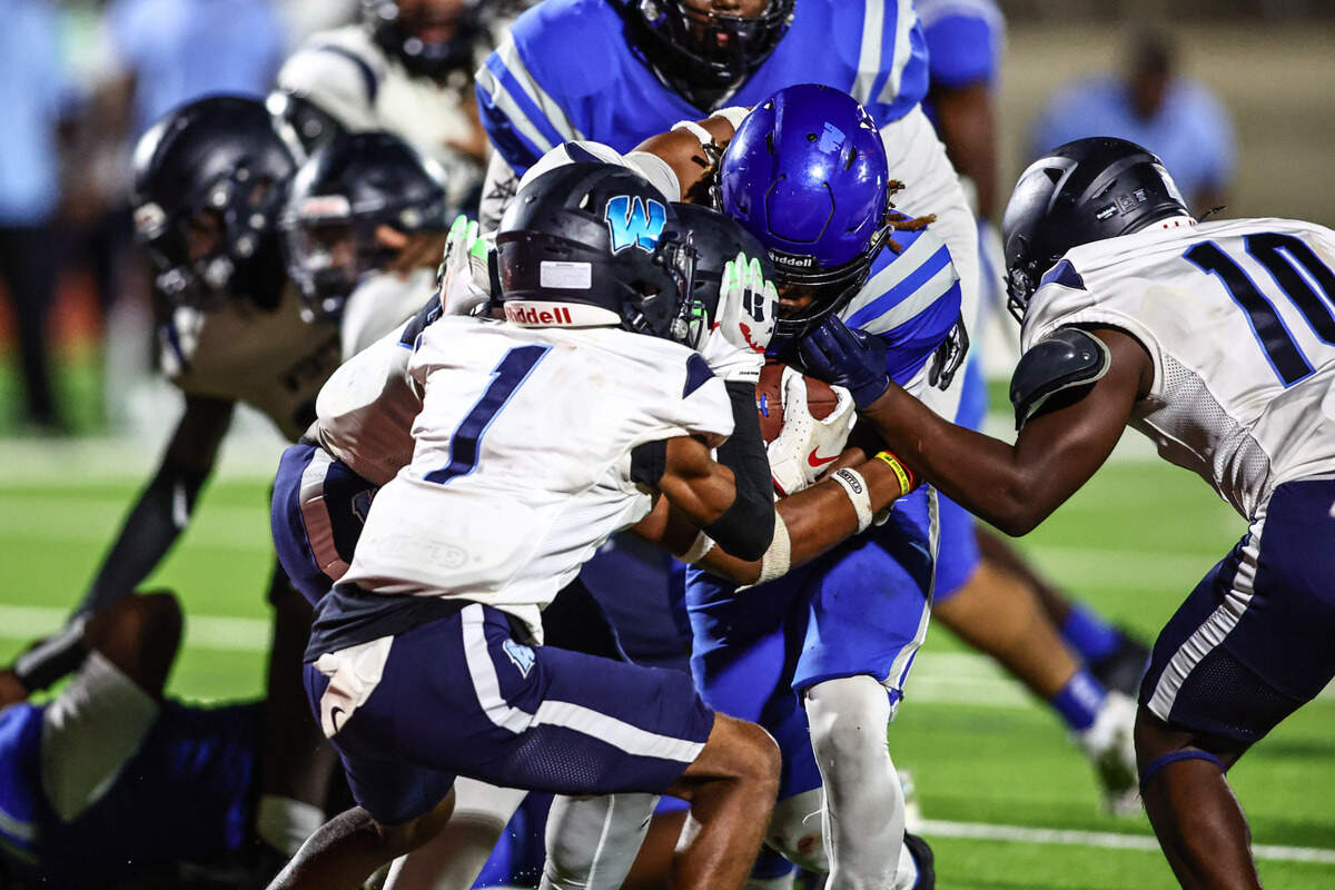Dunbar running back JaMarion Garrett powers into the end zone against Wyatt’s defense to score the winning two-point conversion on Thursday, September 5, 2024 at Clark Stadium in Fort Worth, Texas. Dunbar rallied to defeat Wyatt 14-13.