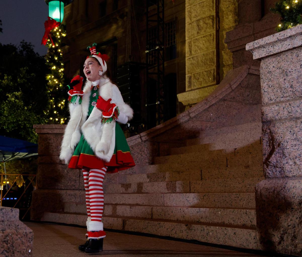 Richland freshman Sofia Luttrull entertained with Christmas songs on the Tarrant County Courthouse.