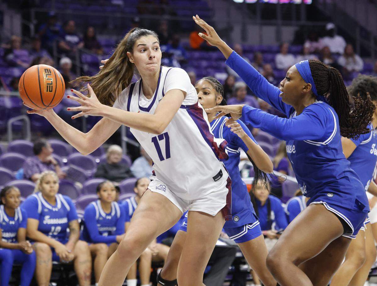 TCU center Clara Silva (17) gets a pass off to team mate guard Maddie Scherr (22) during the first quarter of a NCAA women's basketball game between Tennessee State and TCU at Schollmaier Arena in Fort Worth, Texas, Wednesday Nov. 12, 2025.