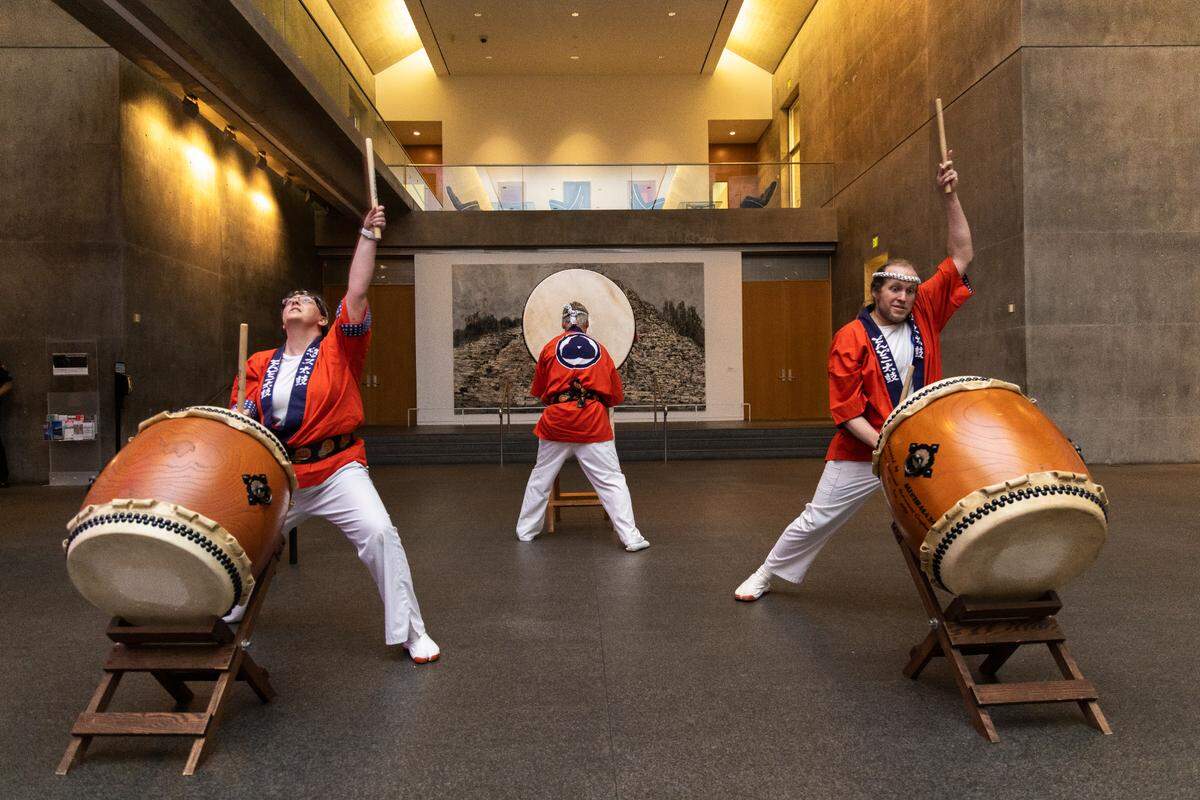 Three Taiko drummers perform in the Modern Art Museum of Fort Worth's Grand Lobby.