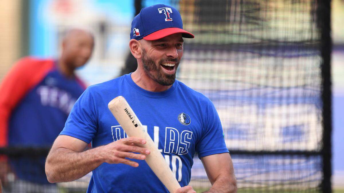 Texas Rangers manager Chris Woodward smiles during batting practice before a game against the Baltimore Orioles, Saturday, Sept. 25, 2021, in Baltimore.