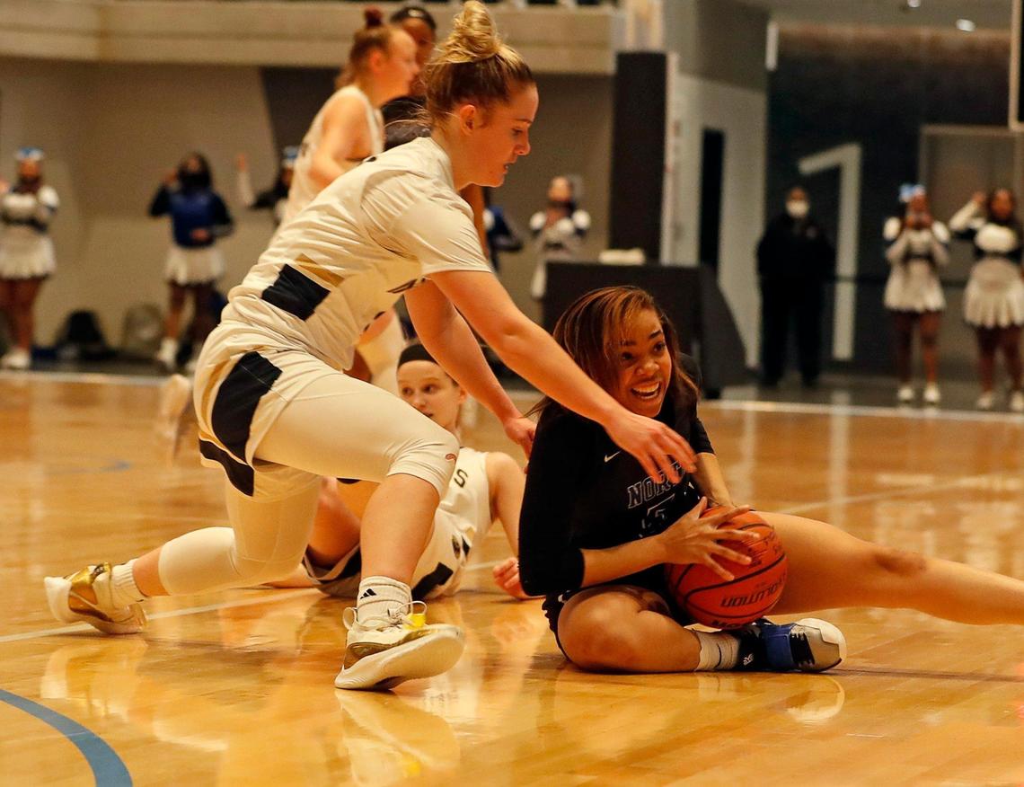 Keller guard Cambridge Mathews (2) and North Crowley guard Kayla Thompson (5) battle for the ball during the first half of a Division 6A Region 1 quarterfinal basketball game at Arlington ISD Complex in Arlington, Texas, Thursday, Feb. 25, 2021. Keller led 31-26 at the intermission. (Special to the Star-Telegram Bob Booth)