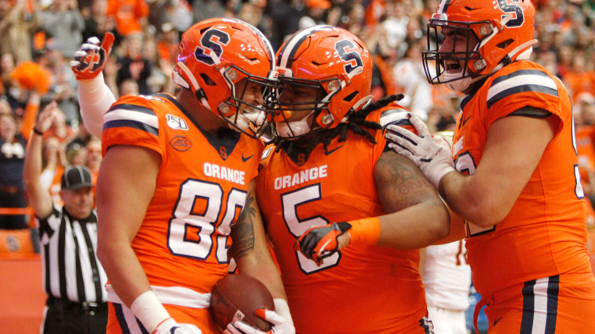 In this file photo, tight end Aaron Hackett, left, celebrates with Syracuse teammates after scoring a touchdown in 2019. Hackett announced Monday he’ll be heading to TCU this season as a graduate transfer.