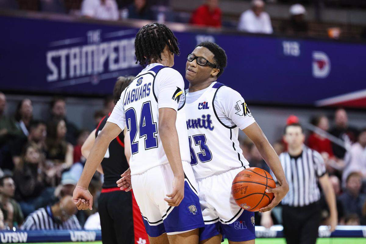 Mansfield Summit guard Javon Ross (33) holds the ball and bumps chests with his teammate Joseph Creal III (24) after a Lovejoy timeout during a Class 5A Division II state semifinal at Moody Coliseum in Dallas, March 10, 2026.