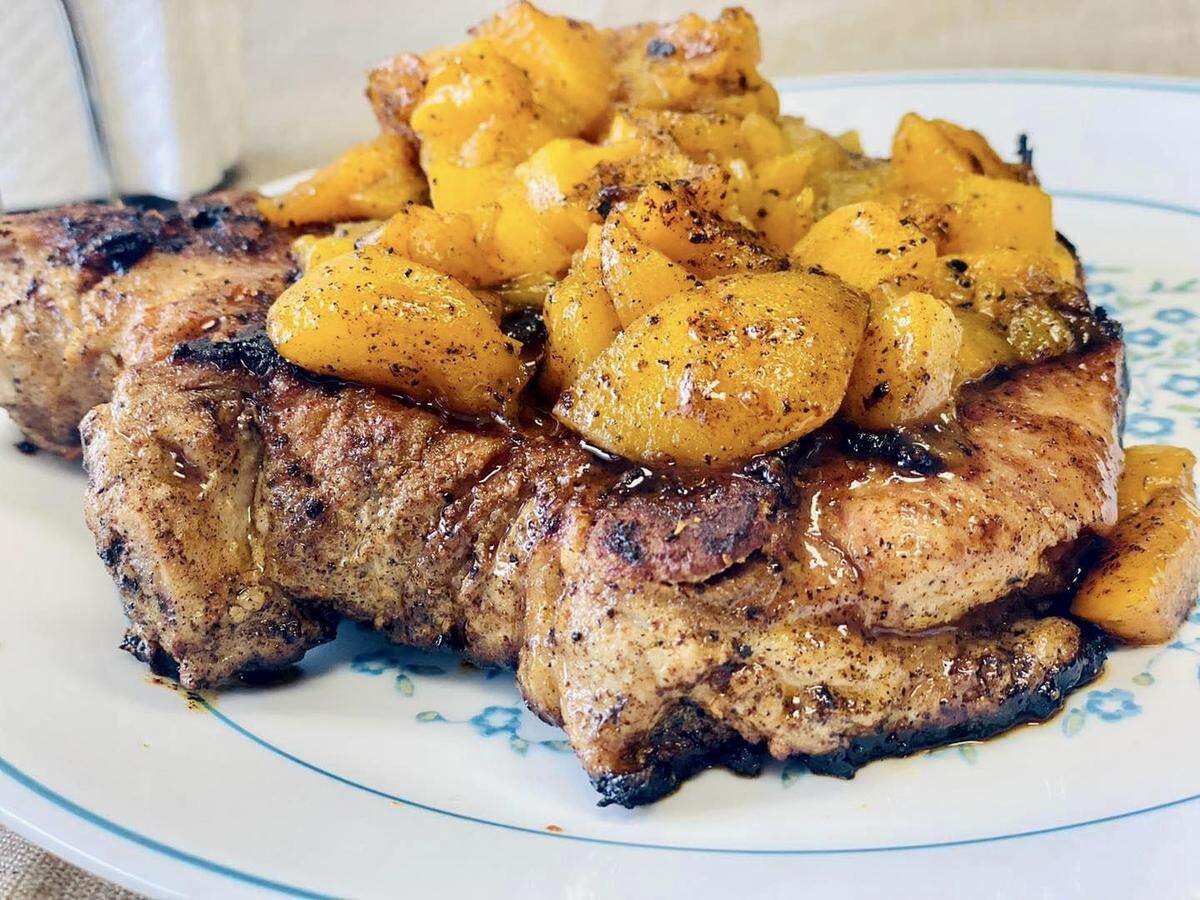 Grilled peaches on pork chops at the Singing Chef Cafe.