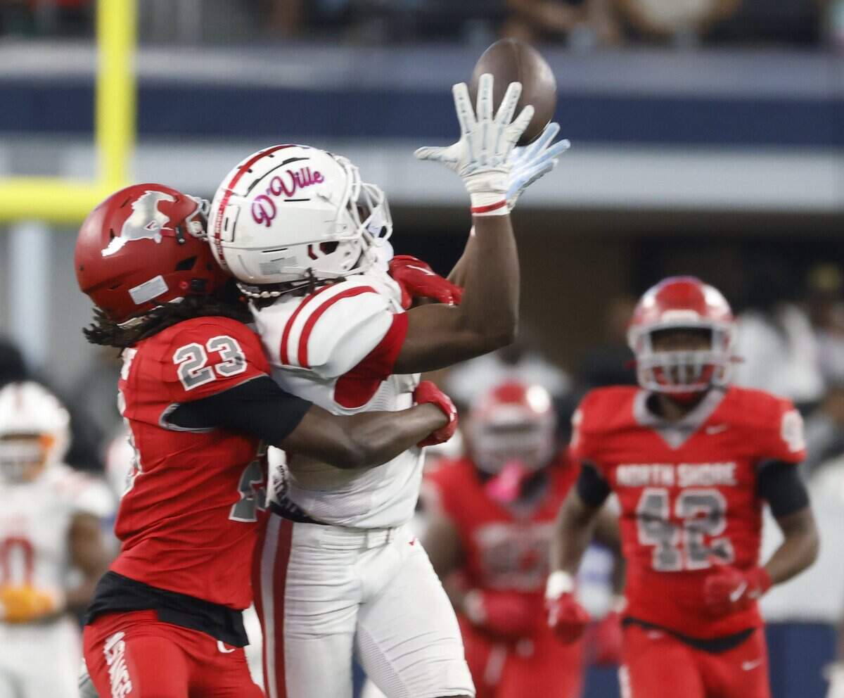 Duncanville wide receiver Trenton Yancey hauls in the pass with Houston North Shore cornerback Marvin Beo draped all over him during the first half of the UIL Class 6A Division I championship game on Saturday Dec. 20, 2025 at AT&T Stadium in Arlington, Texas.