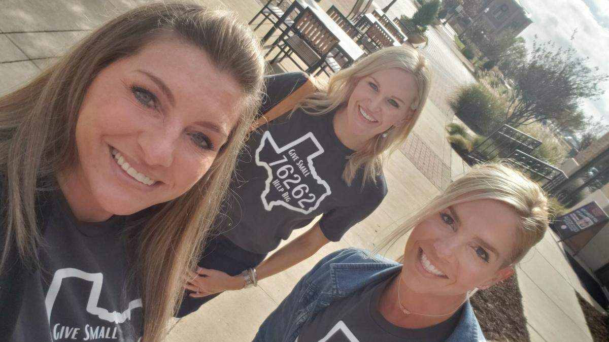 Candice Hill, left, Heather Hancock and Erica Cawley are among those working to help make the project Give Small, Help Big 76262 a success. The shirts they are wearing are sold, with all proceeds going to help local residents and local businesses in that ZIP code.