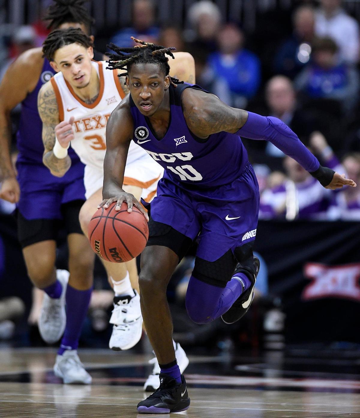 TCU’s Damion Baugh picked up a loose ball and headed down court during the first half of Thursday’s Big 12 Tournament game at the T-Mobile Center in Kansas City.