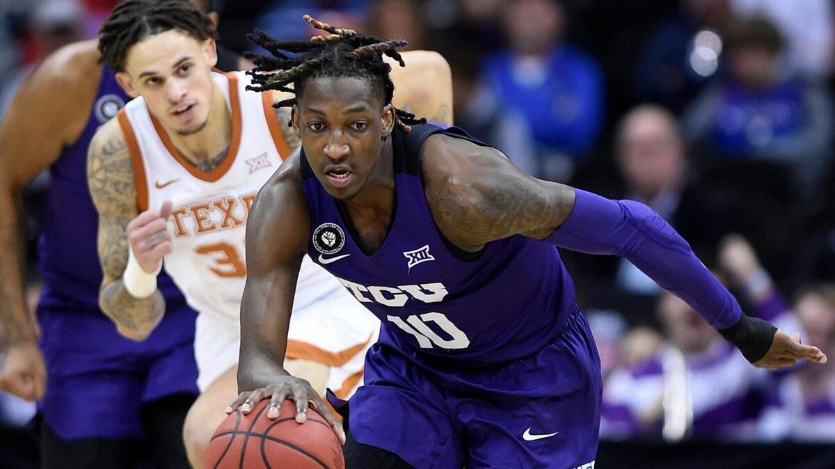 TCU’s Damion Baugh picked up a loose ball and headed down court during the first half of Thursday’s Big 12 Tournament game at the T-Mobile Center in Kansas City. Baugh will serve a six-game suspension for signing with an agent in the off-season.