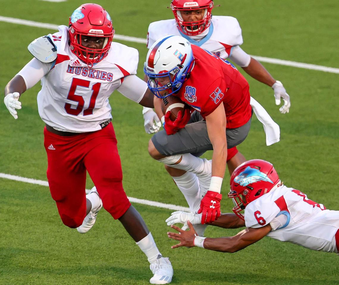 Midlothian Heritage Jaguars running back Cullen Stone (2) tries to avoid a tackle from Wichita Falls Hirschi defensive back Kheyln Sapp (6) during the first half, Friday night, August 28, 2020 played at Midlothian ISD Multi-Purpose Stadium in Midlothian, TX.