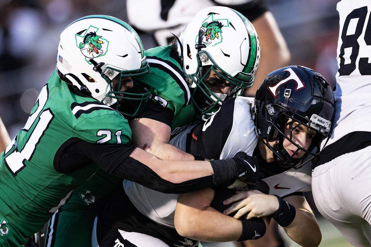 The Soutlake defense sacks Euless-Trinity quarterback Mack Lineweaver (2) in the first half of an high school game between Southlake Carroll and Euless-Trinity at Dragon Stadium in Southlake on Friday, Sept. 19, 2025.