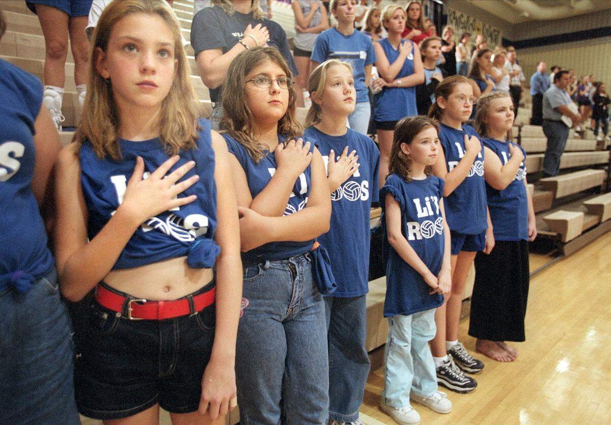 Sixth-graders from Austin Elementary in Weatherford in a moment of silence for the terrorism victims and families followed by the National Anthem before a volleyball game on Sept. 12, 2001.