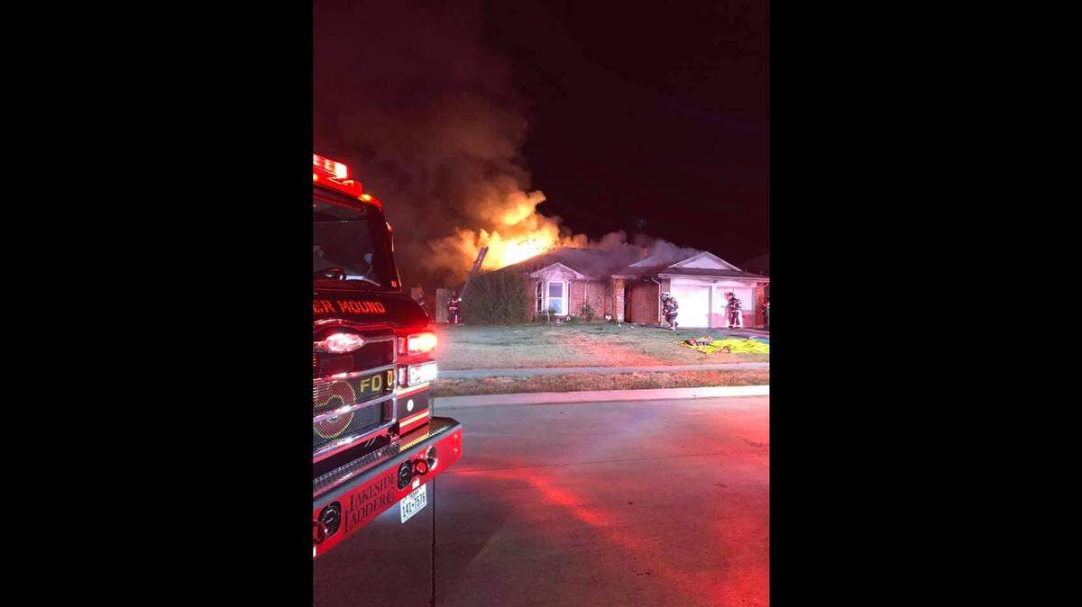Firefighters in Flower Mound, TX respond to a house fire early Thursday morning. The fire department reported firefighters rescued one trapped person in the fire that also resulted in the death of a dog.