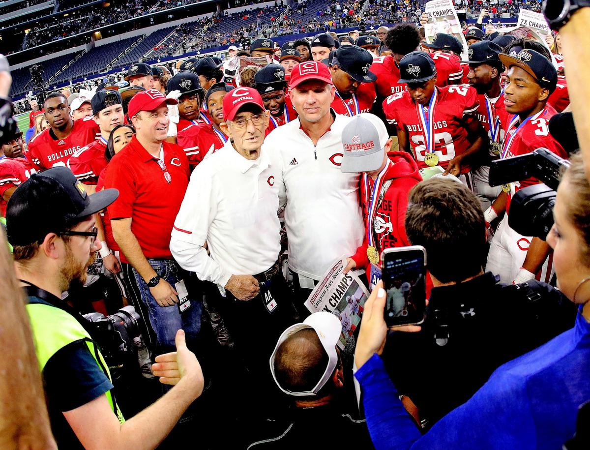 Carthage head coach Scott Surratt and his father Ray mug for the media after winning the Conference 4A division I State Championship football game at AT&T in Arlington, Texas, Friday, Dec. 20, 2019. Carthage defeated La Vega 42-28. (Special to the Star-Telegram Bob Booth)