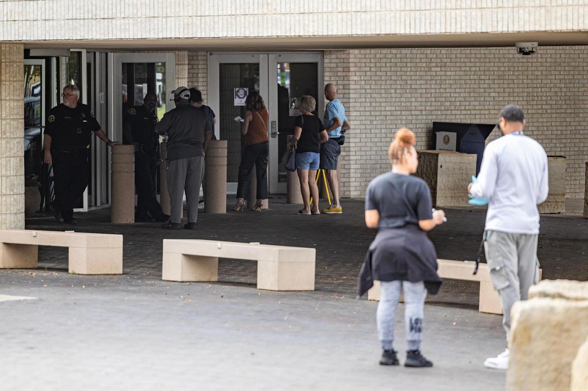 A line forms outside of the voting center for early voting at the Tarrant County Sub-courthouse in Mansfield on Wednesday, Oct. 30, 2024.