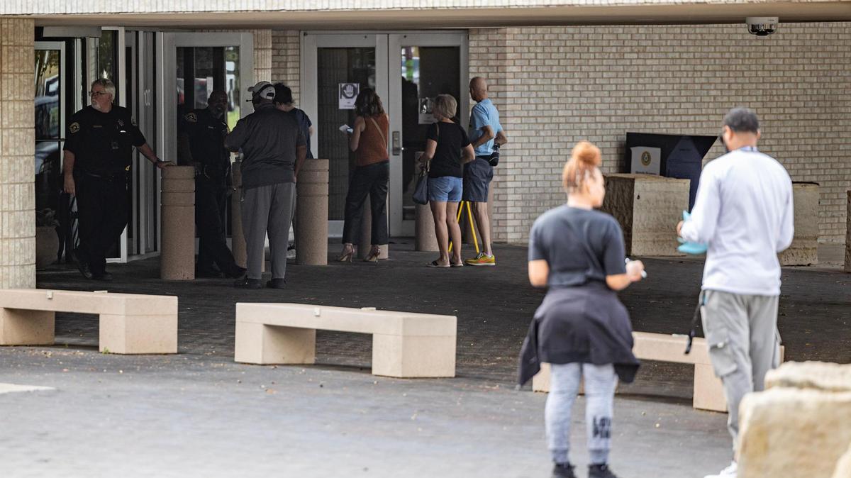A line forms outside of the voting center for the last day of early voting at the Tarrant County Sub-courthouse in Mansfield on Wednesday, Oct. 30, 2024.
