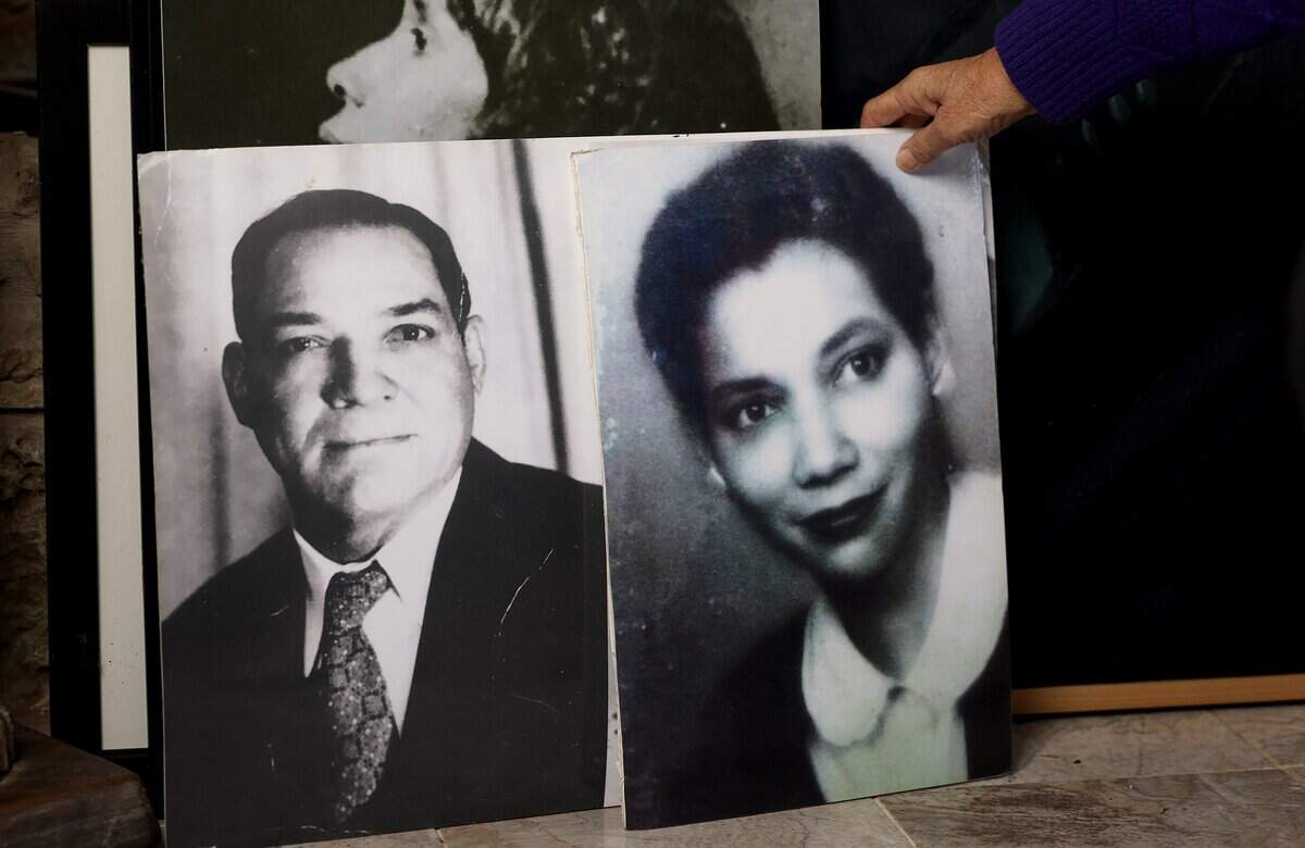 Retired judge Maryellen Hicks shows photographs of her ancestors on Monday, Feb. 23, 2026. Throughout her career, Hicks achieved numerous milestones, including serving as the first and only African American woman to hold the position of state district judge in Fort Worth.