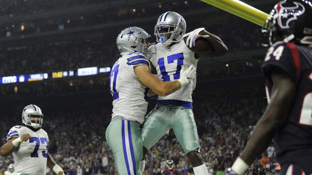 Dallas Cowboys wide receiver Allen Hurns (17) celebrates his touch down catch with teammate Geoff Swaim (87) during the second half of an NFL football game against the Houston Texans, Sunday, Oct. 7, 2018, in Houston. (AP Photo/Eric Christian Smith)