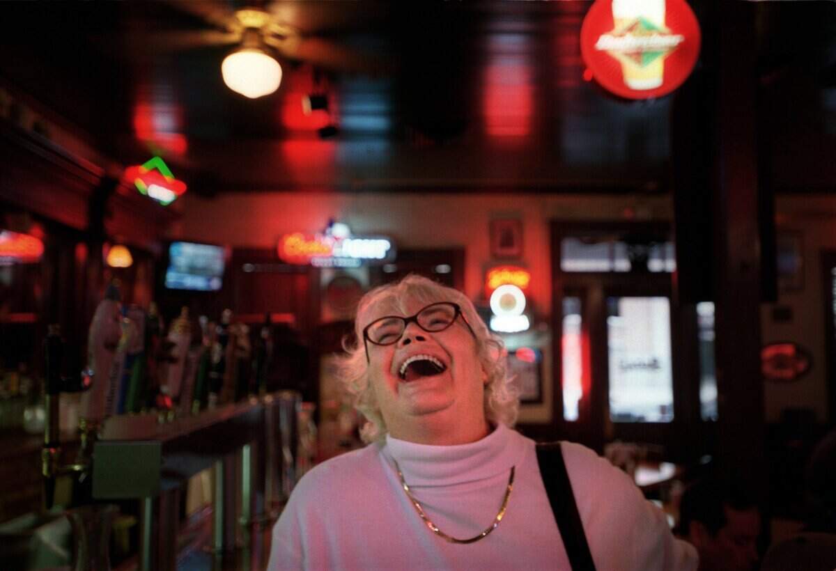 Political columnist and Austin resident Molly Ivins has a laugh during a fundraiser at the Austin political institution Scholz Garten, Oct. 14, 2002.
