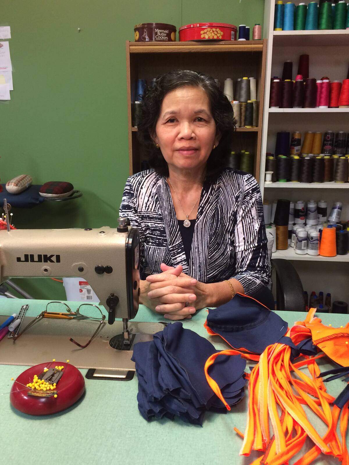Arlington Lamar boys coach Sunny Soeun’s mother Kim Hun Nam at her tailor shop in Abilene. Hun Nam has made over 250 masks in the past months for local first responders.