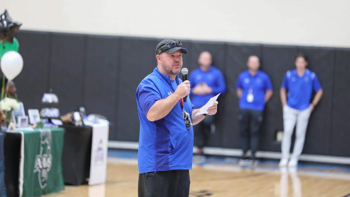 Coach Travis Pride speaks to students at Byron Nelson High School. 