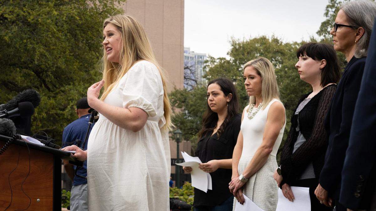 Anna Zargarian, Amanda Zurawski and Lauren Hall listen to fellow plaintiff Lauren Miller share her story in front of the Texas State Capitol in March as they announced their lawsuit, which asks for clarity in Texas law as to when abortions can be provided under the “medical emergency” exception. Fort Worth native Dr. Dani Mathisen joined the lawsuit in November.
