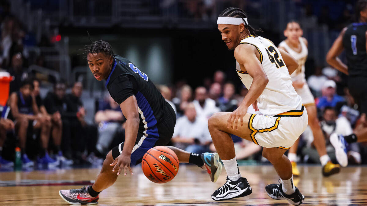 North Crowley guard Kameron Price (2) looks toward a loose ball and starts his diving attempt to recover it as a San Antonio Brennan defender goes for the ball in the Class 6A Division I state championship at The Alamodome in San Antonio, Texas, March 14, 2026.