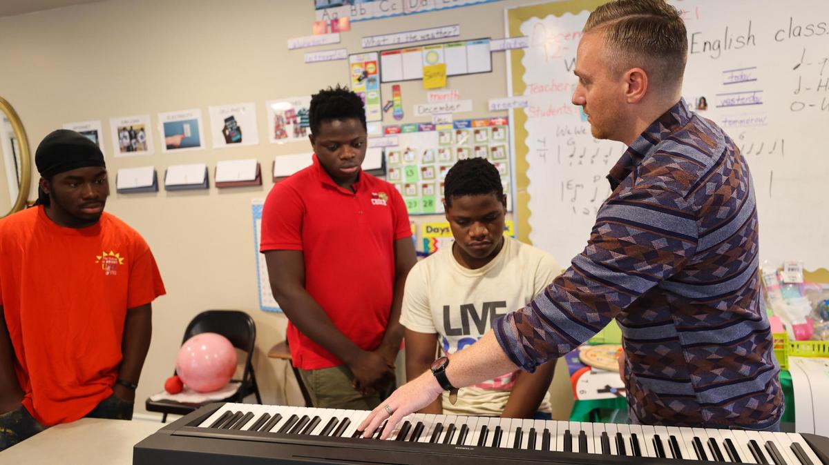 Nathan Harmon with Refugee Services of Texas teaches music theory during the Refugee Music Collaborative in Fort Worth.