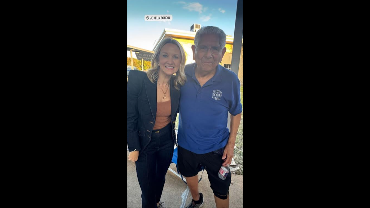 Frank Diaz Jr., dressed in his Citizens on Patrol uniform, poses with Fort Worth Mayor Mattie Parker at Crestwood’s National Night Out event on Oct. 7, 2025.