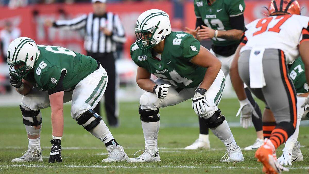 Dartmouth College offensive lineman John Paul Flores, center, graduated from All Saints Episcopal in Fort Worth. He and his brother, Michael, both play at Dartmouth. The Ivy League announced Wednesday that it has shut down the entire fall season.