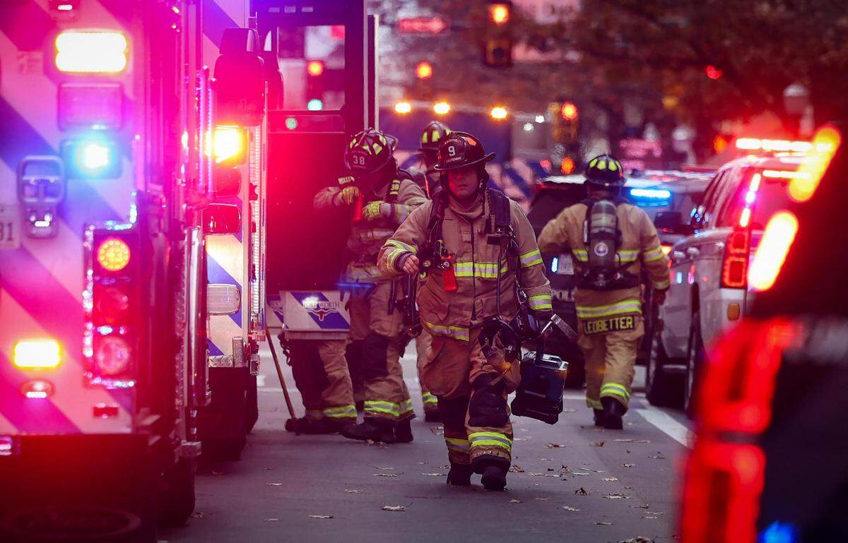 Members of the Fort Worth Fire Department respond to an explosion at the Sandman Signature Hotel in downtown Fort Worth on Monday, January 8, 2024. At least 21 were injured in the explosion.