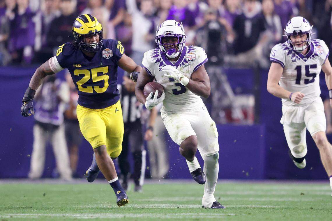 TCU running back Emari Demercado runs for 69 yards to give quarterback Max Duggan touchdown in the next play during their game against Michigan at the Vrbo Fiesta Bowl in Glendale, Ariz., on Saturday, December 31, 2022.