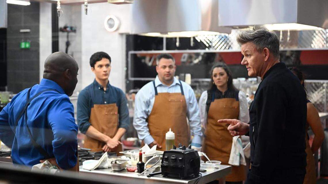 Arlington native Preston Nguyen (navy shirt) listens to celebrity chef Gordon Ramsay on set of “Next Level Chef”.