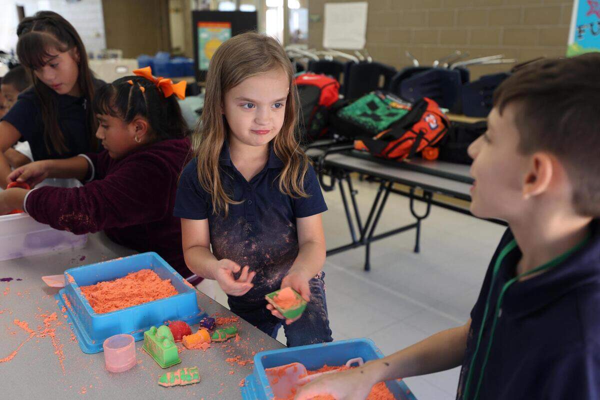 Aurora Dlib plays with sand during an after school program at South Hills Elementary on Wednesday, Oct. 12, 2022, in Fort Worth. Clayton Youth Enrichment is a nonprofit that offers before and after school programs for students across Tarrant County.