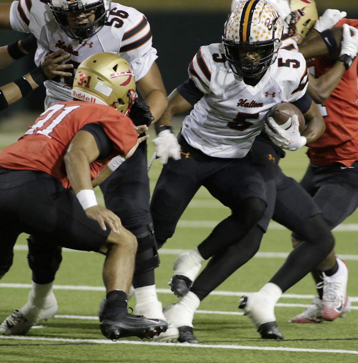 Haltom’s Vudrico Roberson avoids a tackle against South Grand Prairie’s defense during their game at the Gopher-Warrior Bowl on Friday, Oct. 31, 2025. 