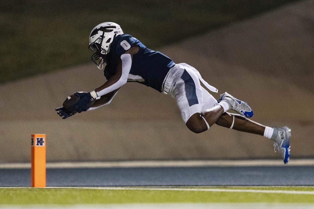 Keller running back Temi Ericson dives for the pylon in the front of the endzone which resulted in a touchdown during the 3rd quarter of a non-district game between Keller and Flower Mound Marcus at Keller ISD Stadium on August 28, 2025.