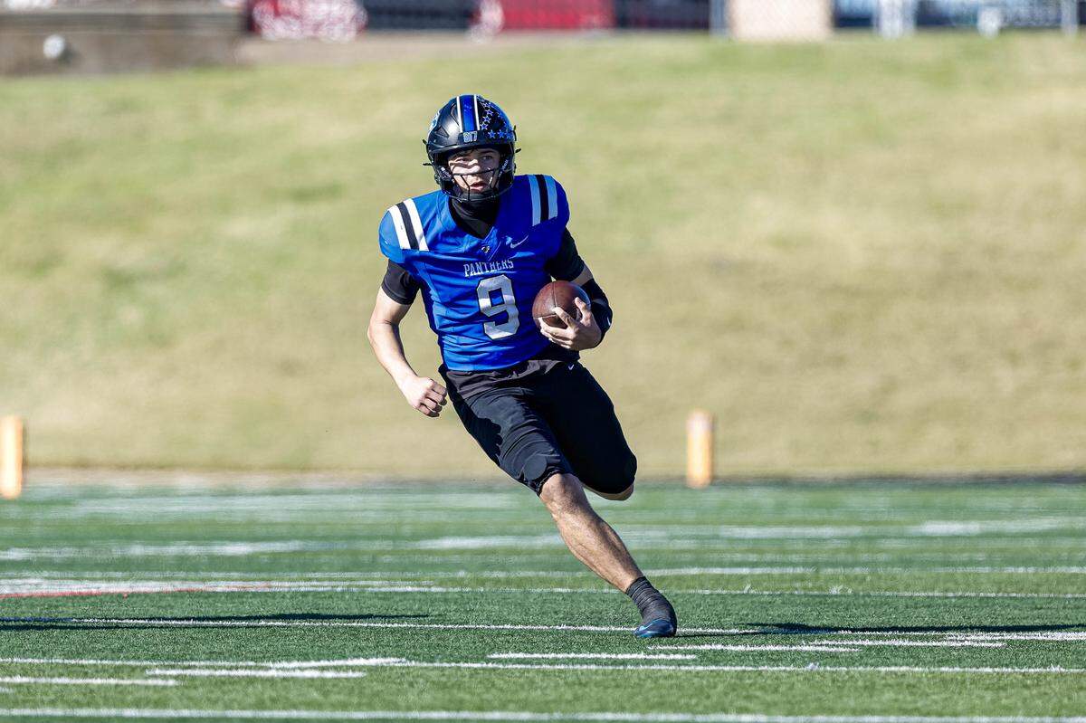 North Crowley quarterback Hayes Cloutier makes a nice gain against Midland Legacy in a Class 6A Division I area-round playoff on Saturday at Shotwell Stadium in Abilene.