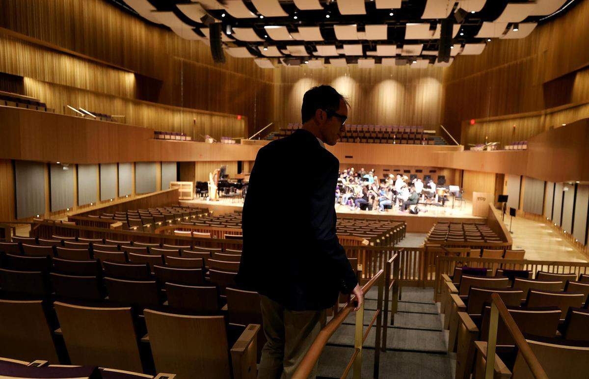 Sean Atkinson, dean of the TCU School of Music, walks down the aisle of the Van Cliburn Concert Hall on Monday, April 4, 2022. The Van Cliburn Concert Hall, located inside TCU’s new $53 million Music Center, will host its first public event on Friday.