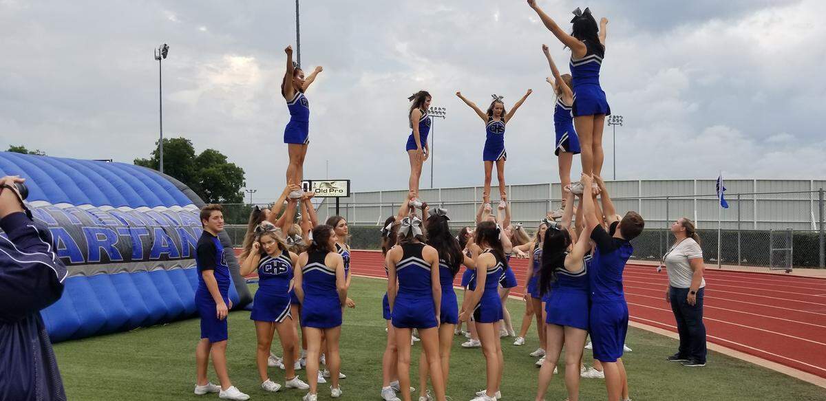 Burleson cheerleaders get ready to cheer on their team.
