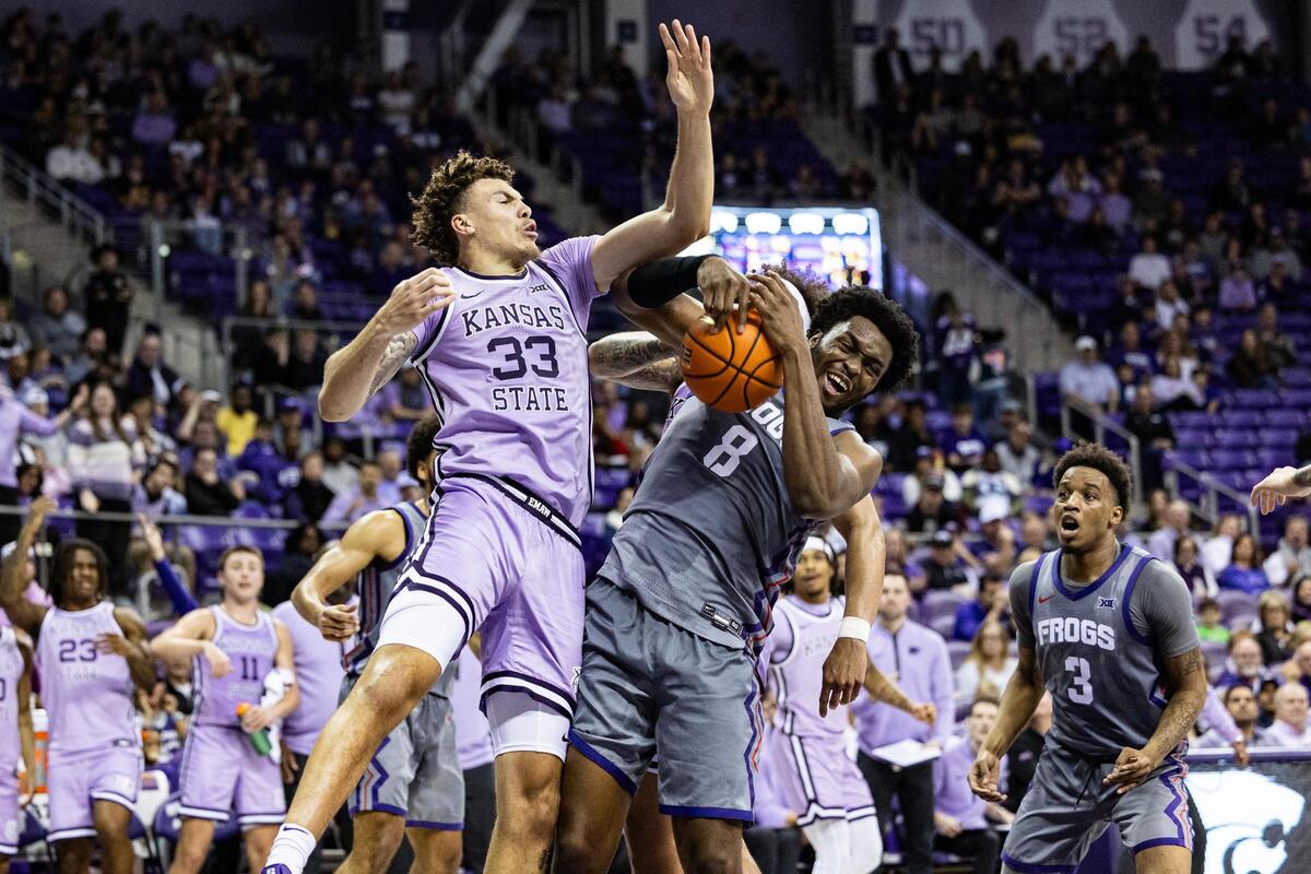 Kansas State forward Coleman Hawkins (33) and TCU center Ernest Udeh Jr. (8) fight for a rebound in the second half of an NCAA game between TCU and Kansas State at Schollmaier Arena in Fort Worth on Saturday, Jan. 4, 2025.