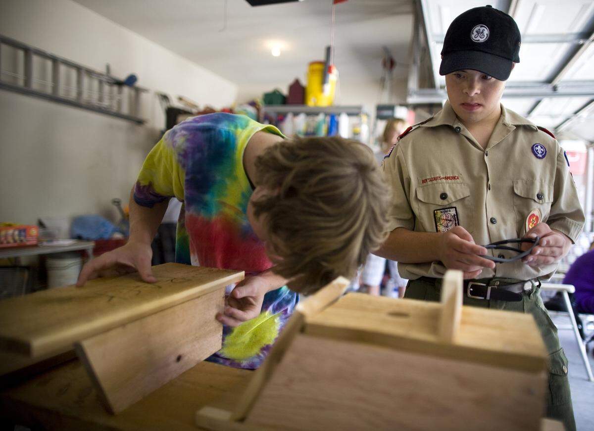 Aug. 29, 2010: Tom Duston, 17, supervises Zach Gillilad, left, as their Boy Scout troop built six birdhouses. Tom is working on his Eagle Scout project by building birdhouses and placing them in Trophy Club park.
