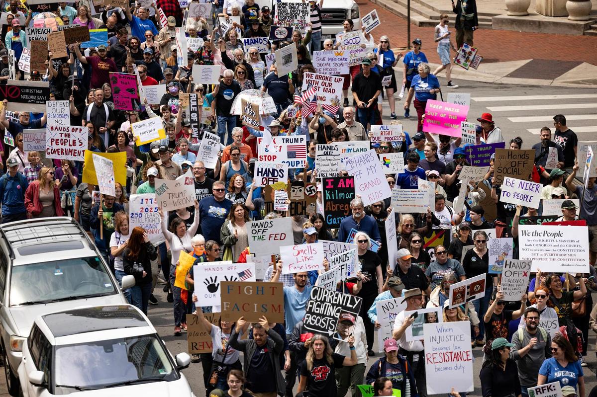 Thousands of protesters march down W 5th Street in downtown Fort Worth on April 19 to protest against the Trump administration.
