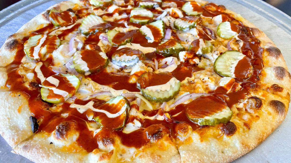 Nashville Hot chicken pizza with pickles from Zalat.