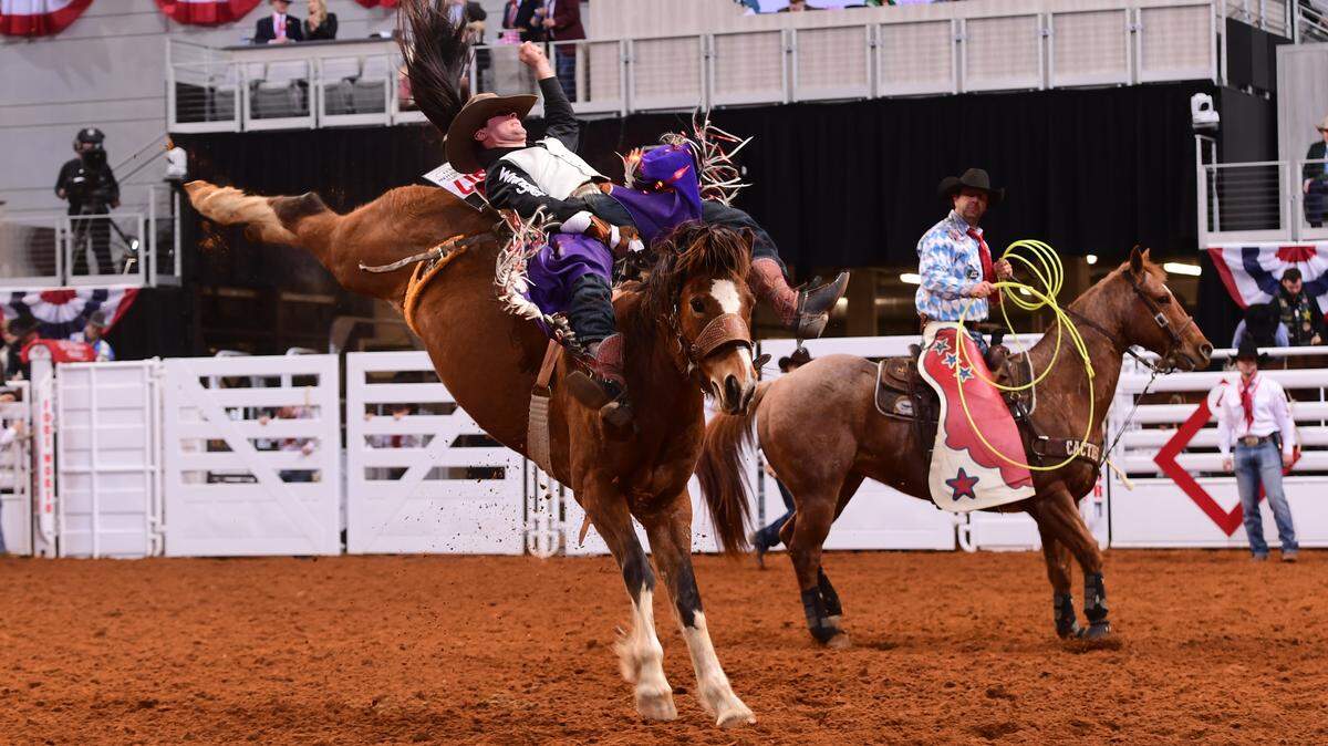 Cole Reiner of Kaycee, Wyoming, competes in bareback riding during the Fort Worth Stock Show Rodeo at Dickies Arena. All rodeo performances this year are broadcast live by the Cowboy Channel, based in the Fort Worth Stockyards.