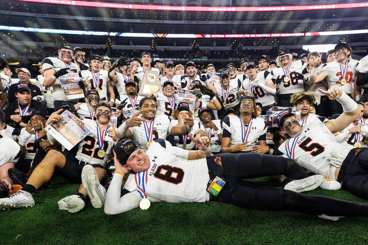 The Aledo Bearcats celebrate after winning the 5A Division I football state championship game against Smithson Valley at AT&T Stadium in Arlington on Friday, Dec. 15, 2023. Aledo won 51-8 to capture the programs 12th state championship.